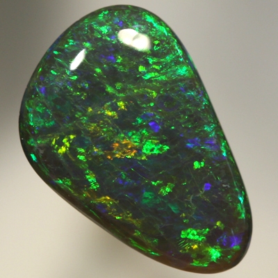 SOLID BLACK OPAL Strong golden fire, top quality.  SEE VIDEO